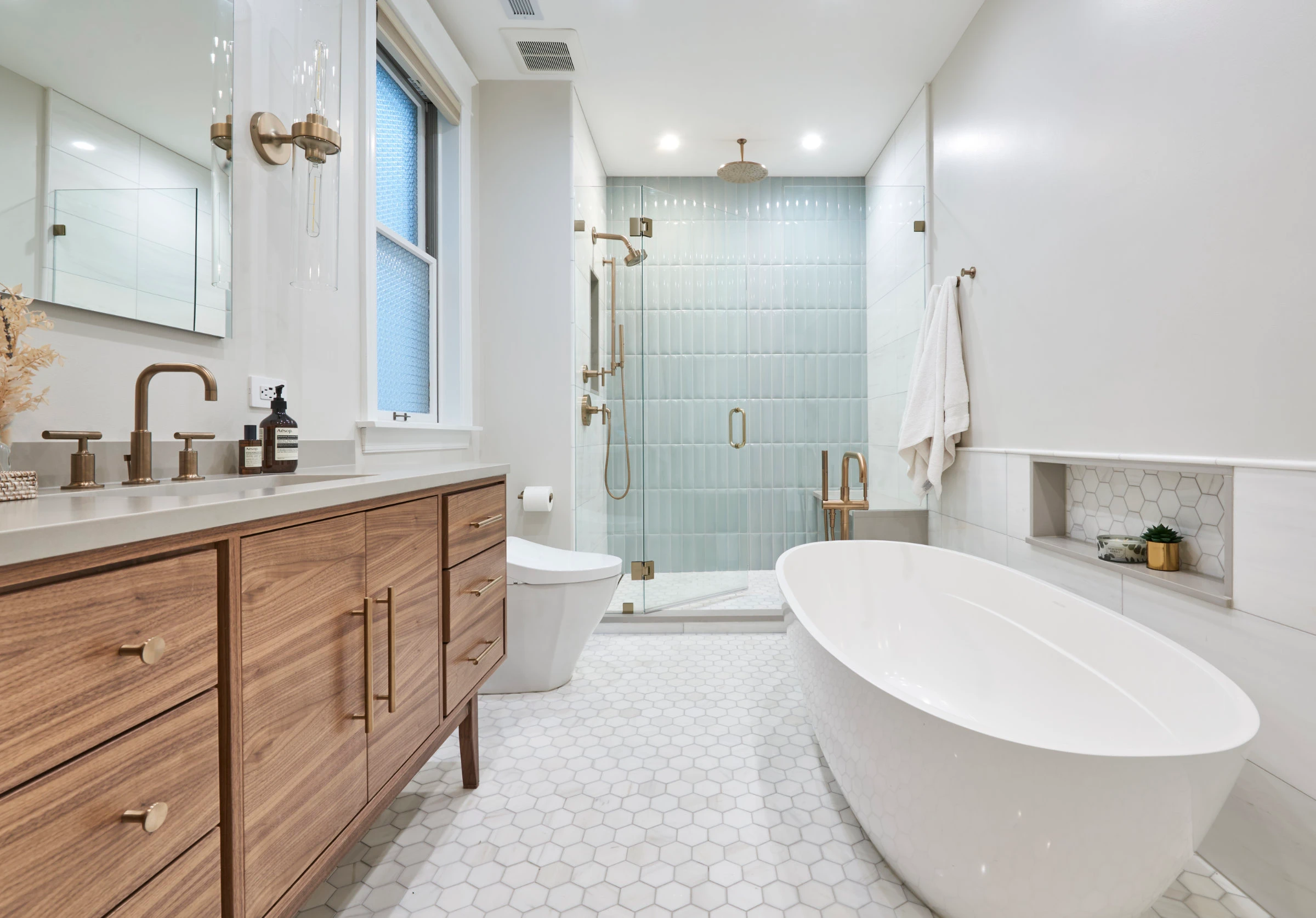 Light wood vanities in renovated bathroom